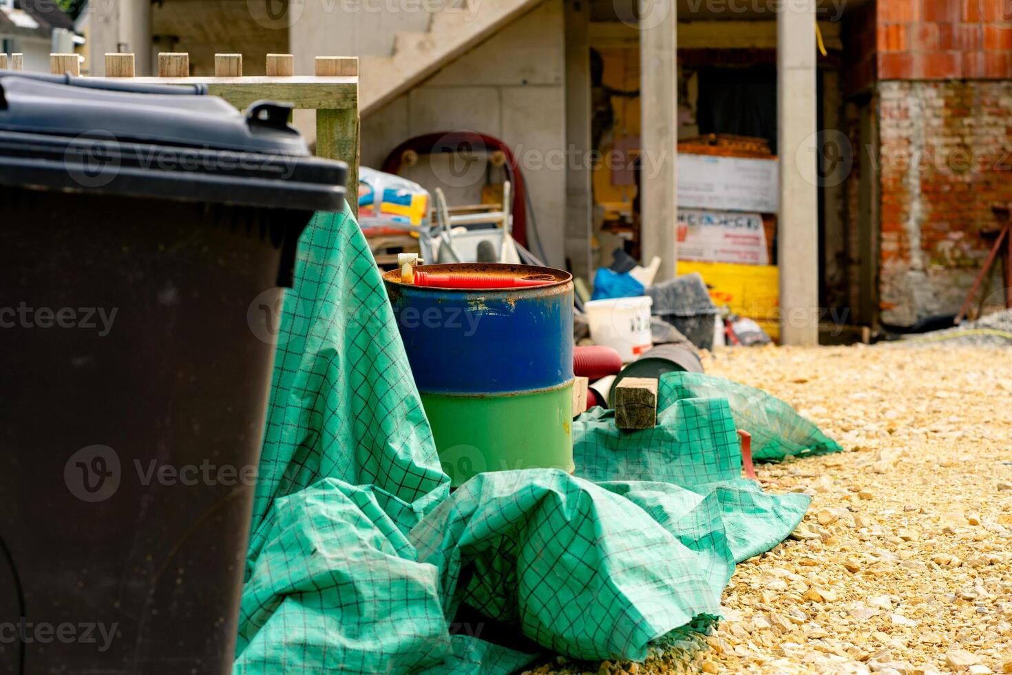 Various building materials and fixtures near a house under construction photo