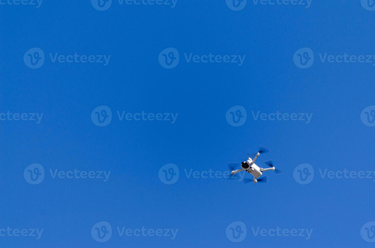 a mini drone that weighs less than 250 grams flying photo