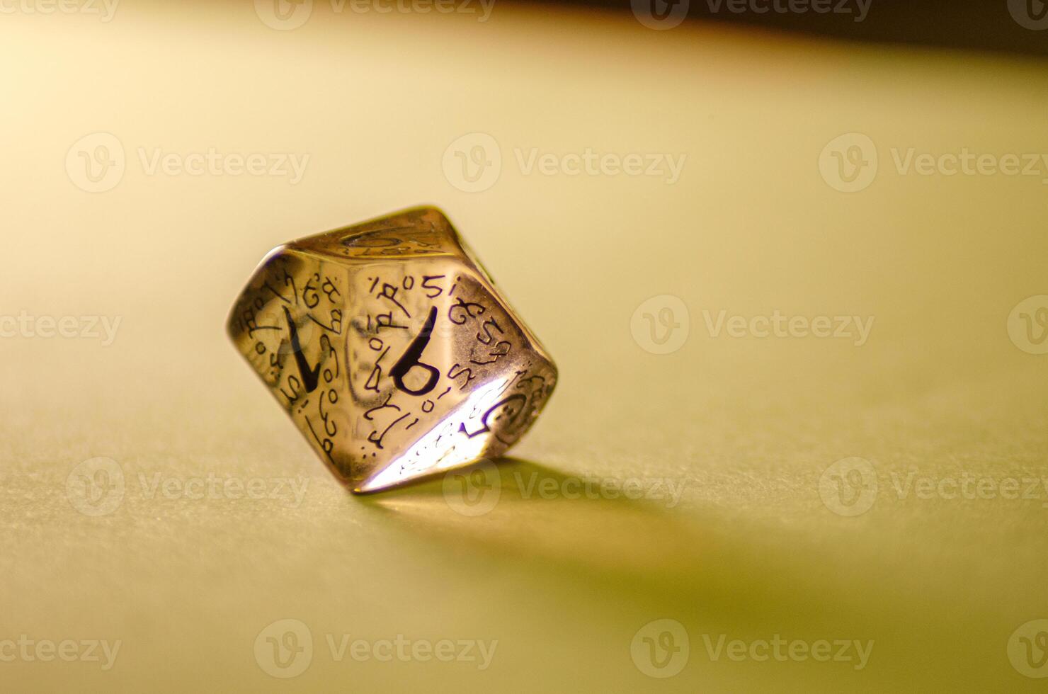 close-up view of a transparent die for board games and role-playing games photo