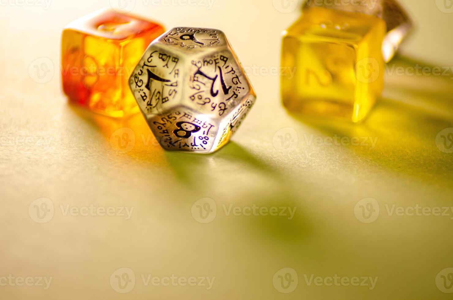 close-up view of three dice of different shapes for board games and role-playing games photo