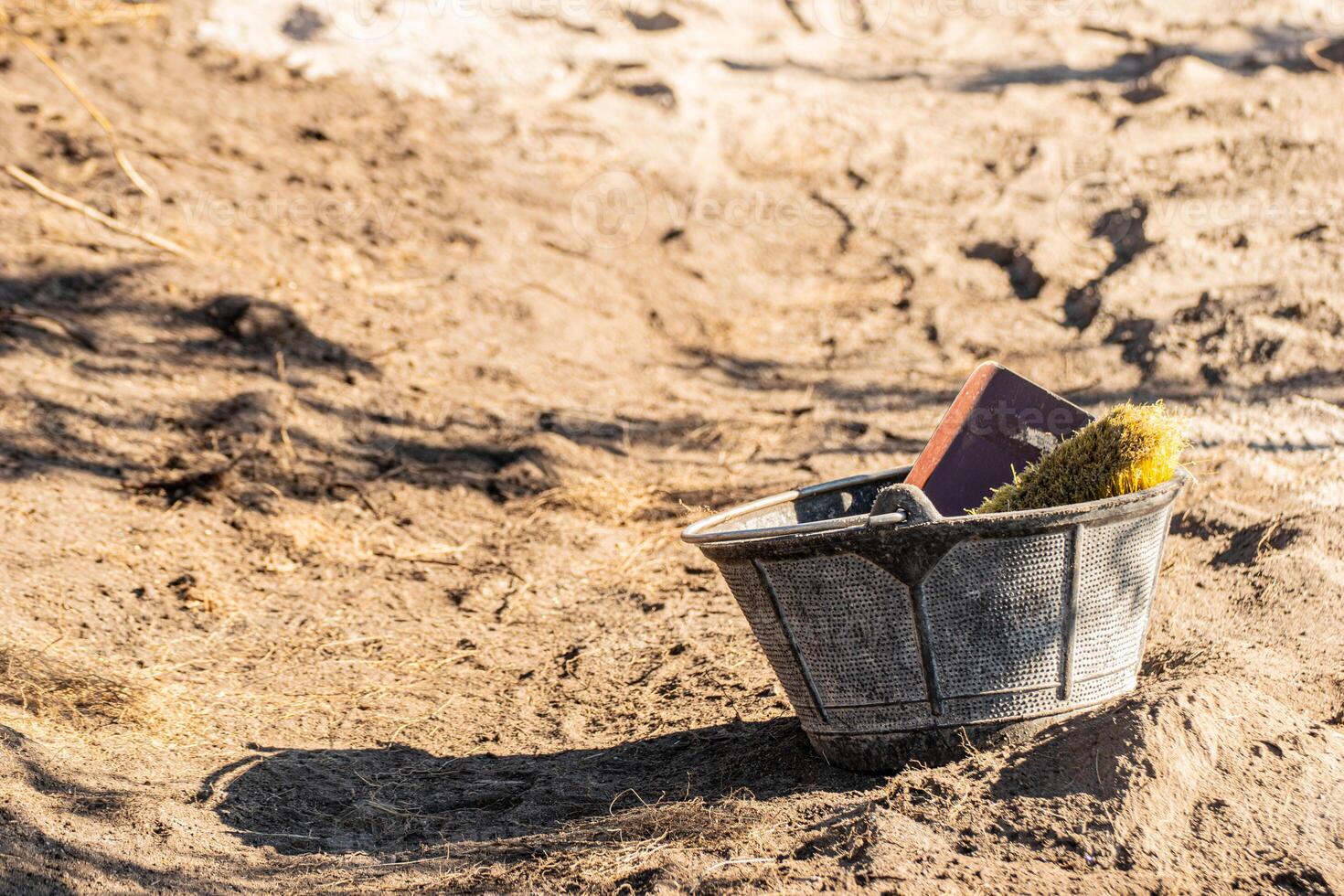cauldron with tools in an archaeological dig photo