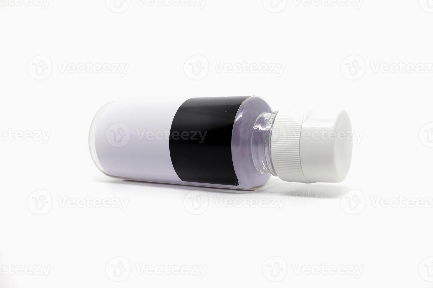 A white and black bottle with a white cap photo