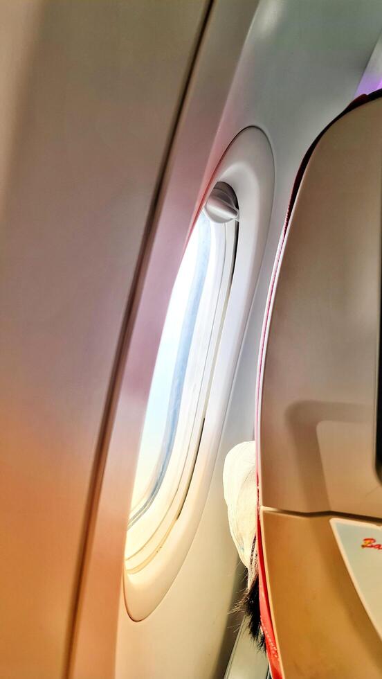 A view of the inside of an airplane with a window photo