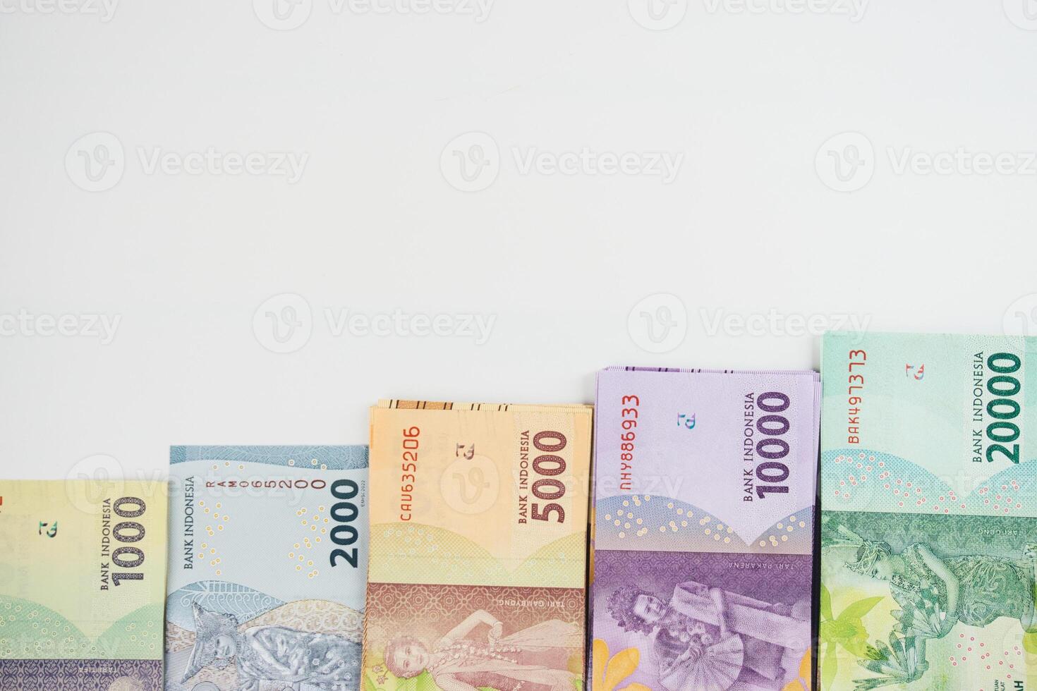 Colorful Indonesian Rupiah Banknotes Arranged in an Increasing Value Order photo