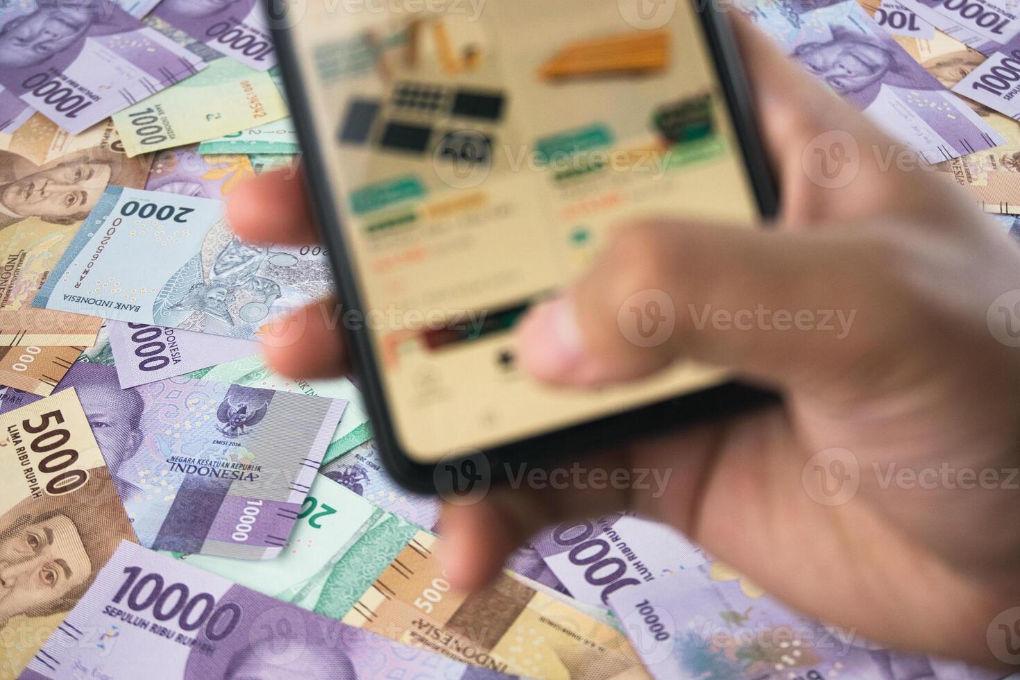 Smartphone Over Banknotes Reflecting Online Transactions and Finance Management photo