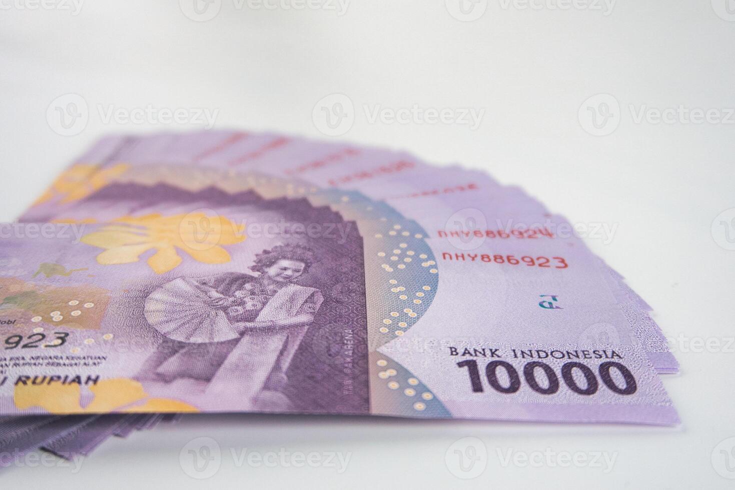 Indonesian Rupiah Banknotes Arranged in an Artistic Display on White Background photo