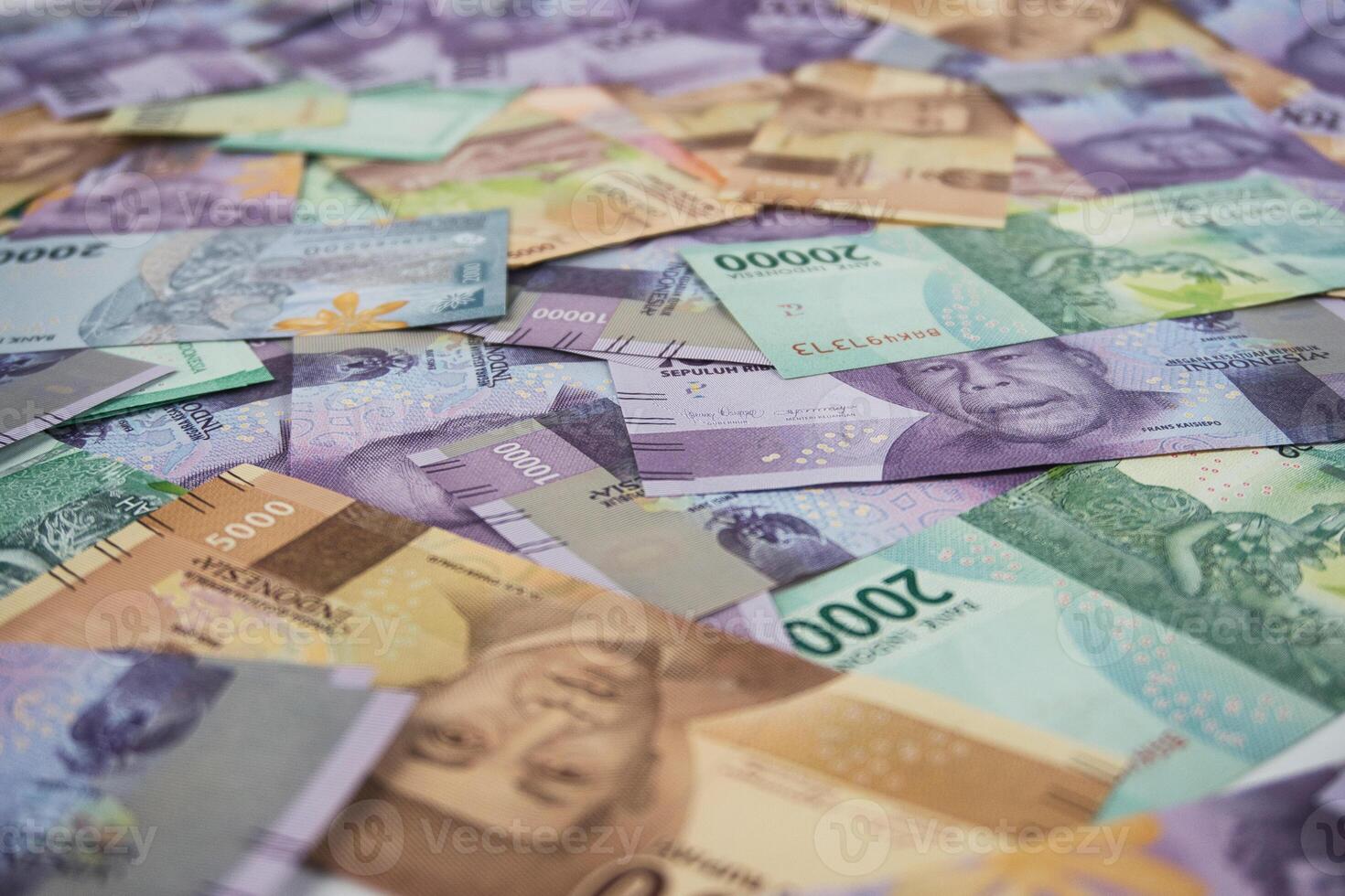 Colorful Indonesian Banknotes Scattered Showing Currency and Financial Concept photo