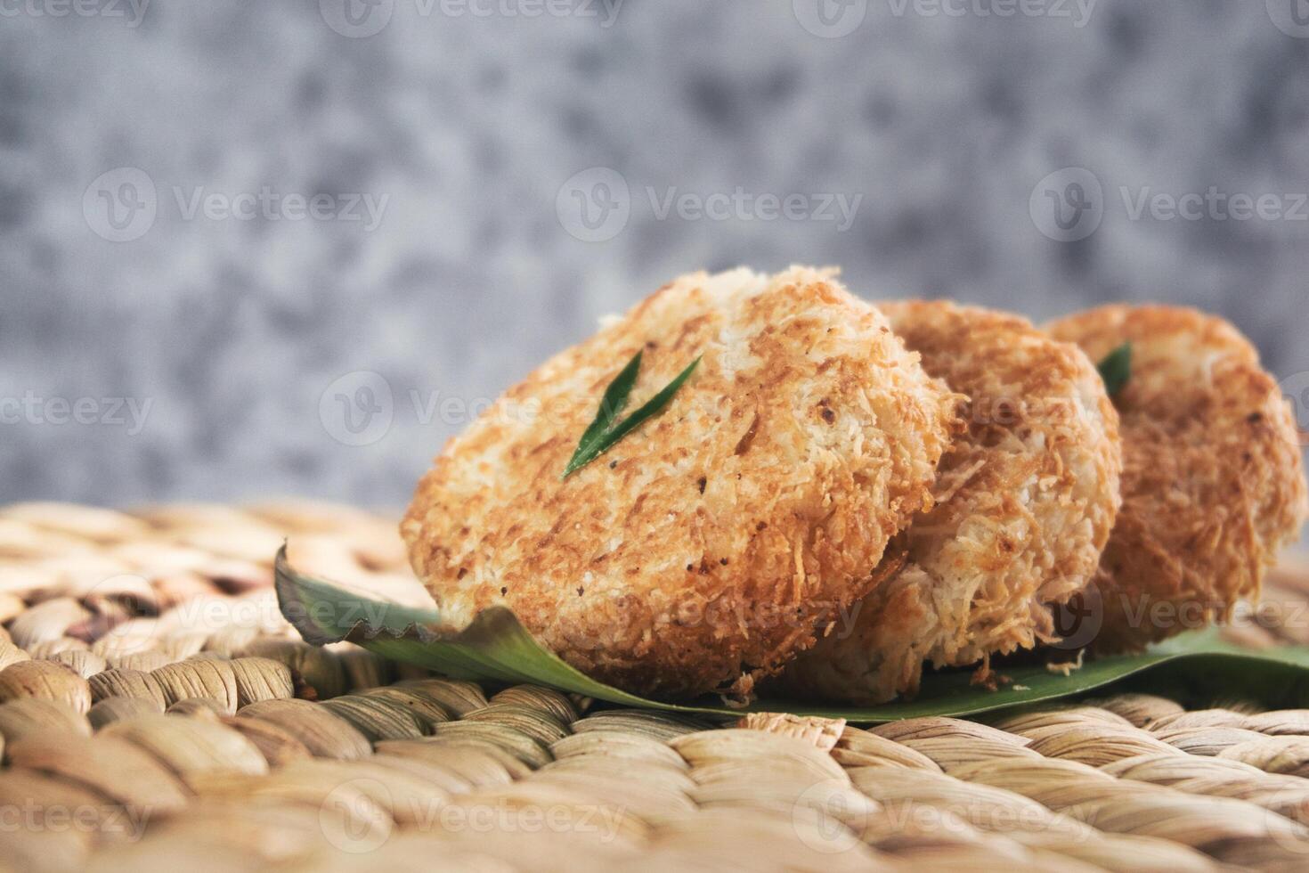 Indonesian Traditional Coconut Cake called Sagon on Banana Leaf with Rustic Background Setting photo