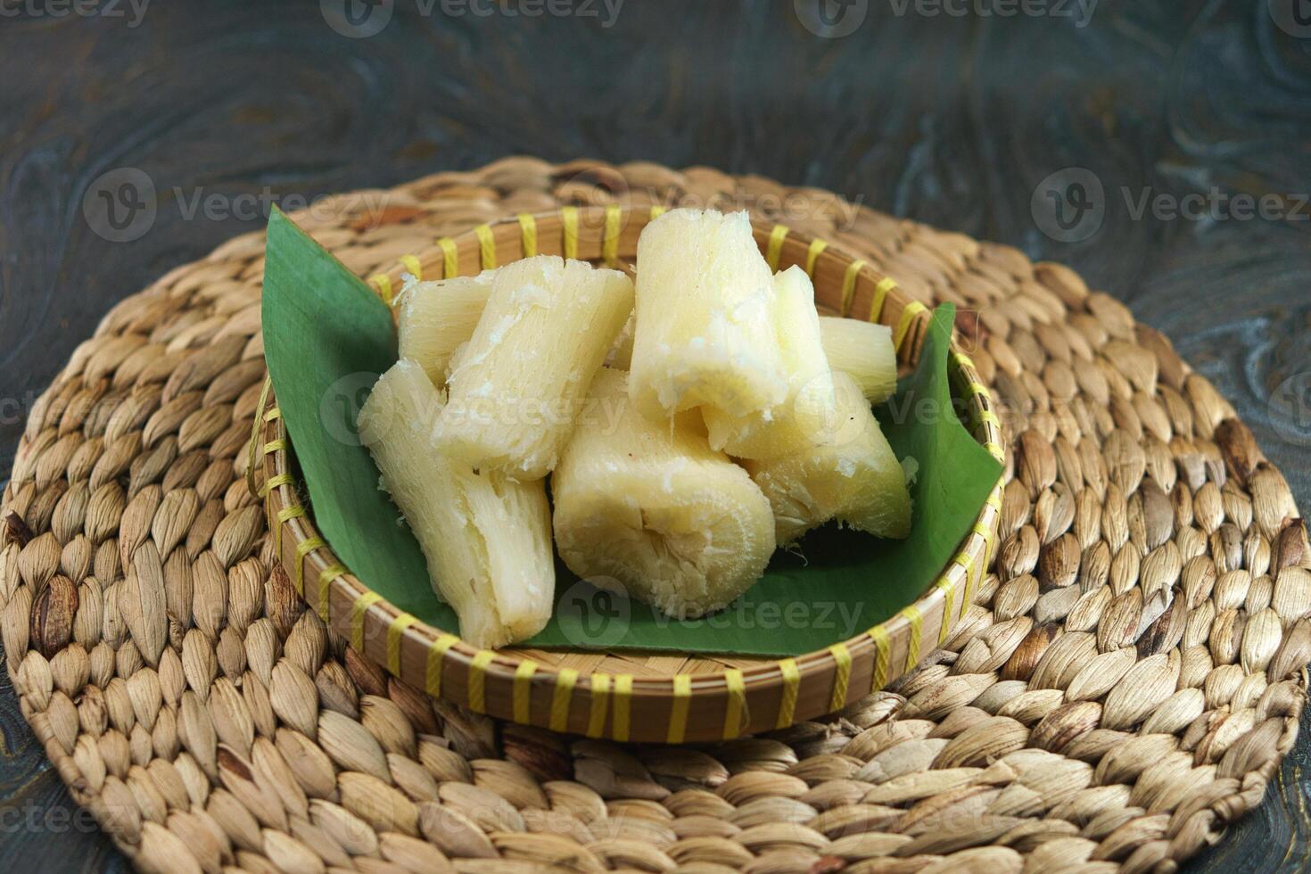 Freshly Cooked Cassava Served in a Traditional Basket on a Rustic Surface photo