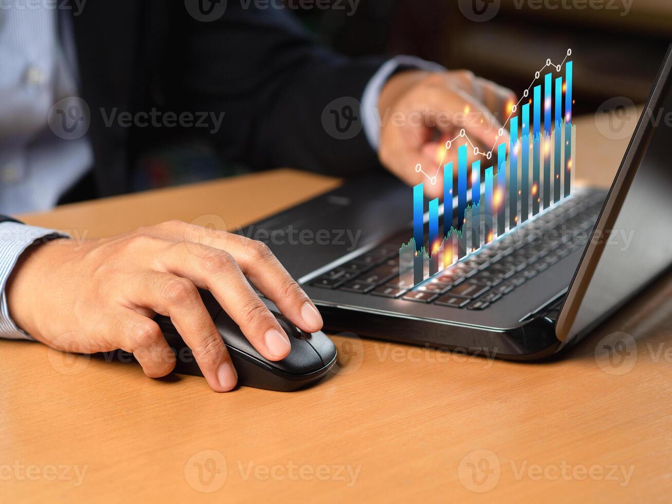 Business person analyzing financial report on a virtual screen while sitting at a desk in the office photo