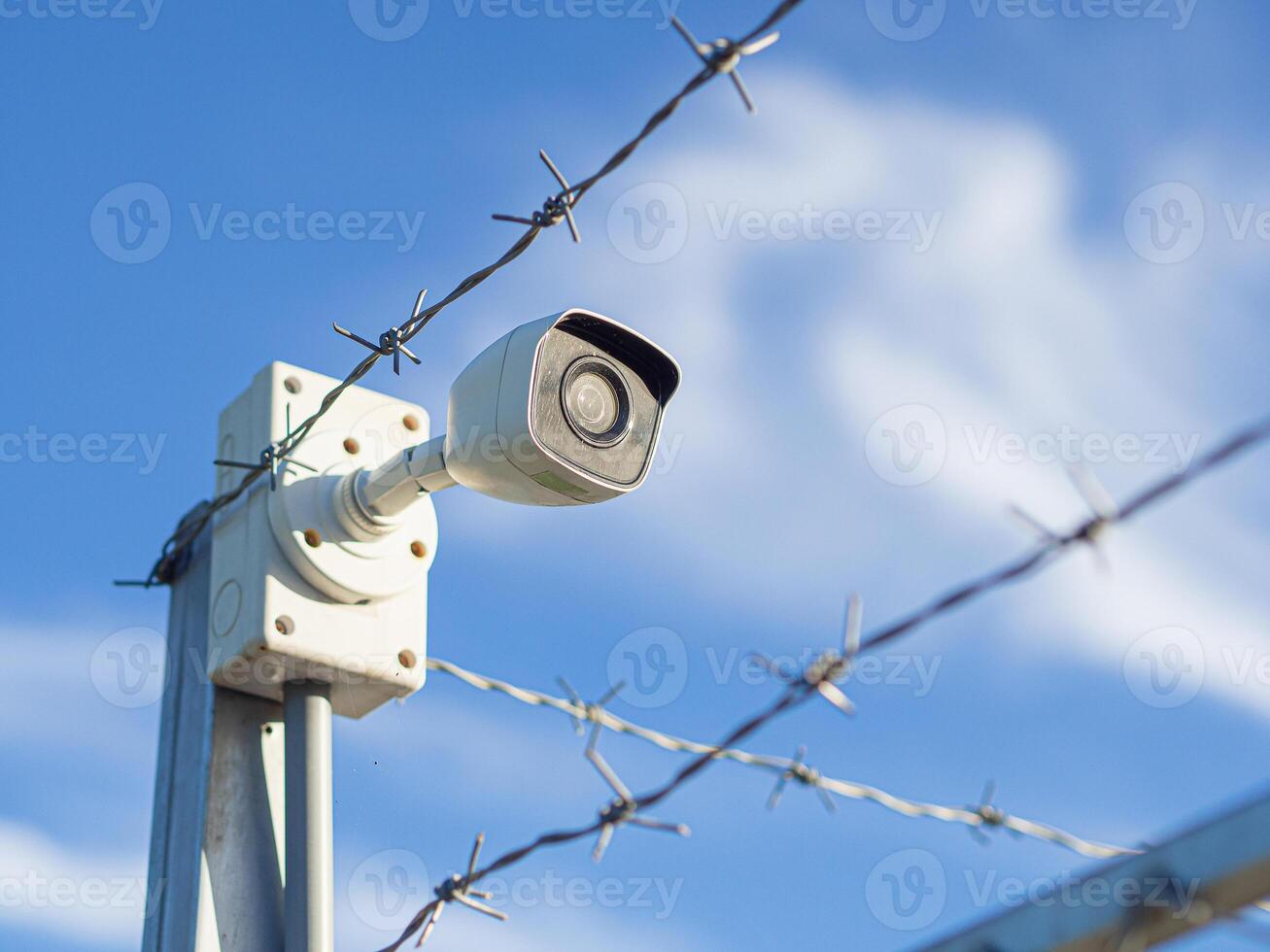 surveillance systems. Security CCTV camera installed in the garden photo