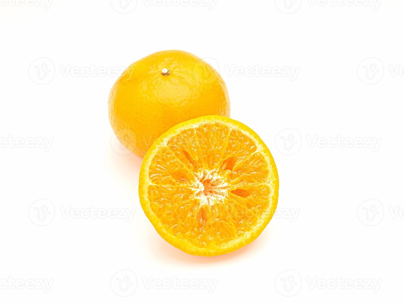 Top view of a slice and whole oranges is over a white background photo