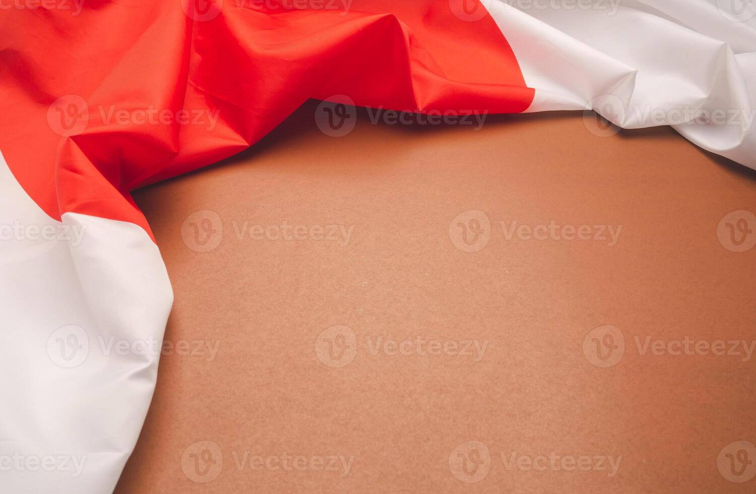 Top view of the Japan flag on a brown background with space for text photo
