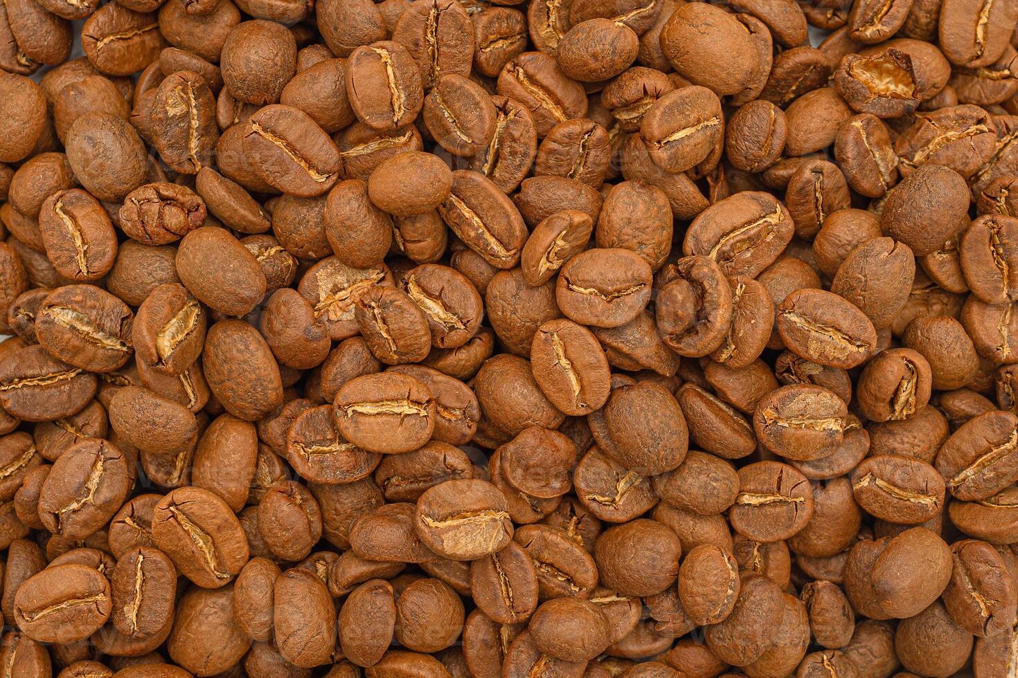 Top view of fresh aromatic roasted coffee beans background photo