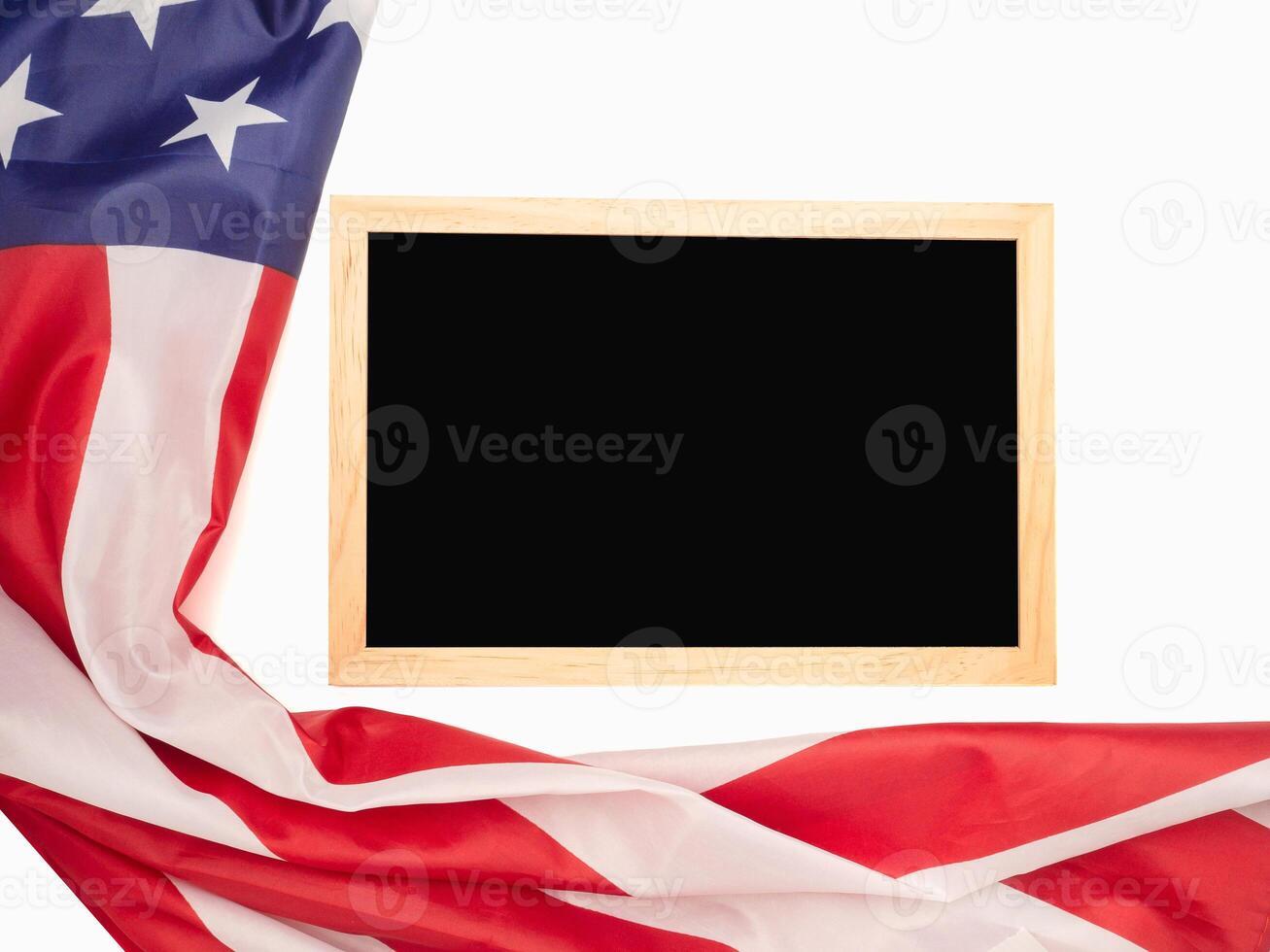 Top view of the American flag and empty blackboard on a white background photo