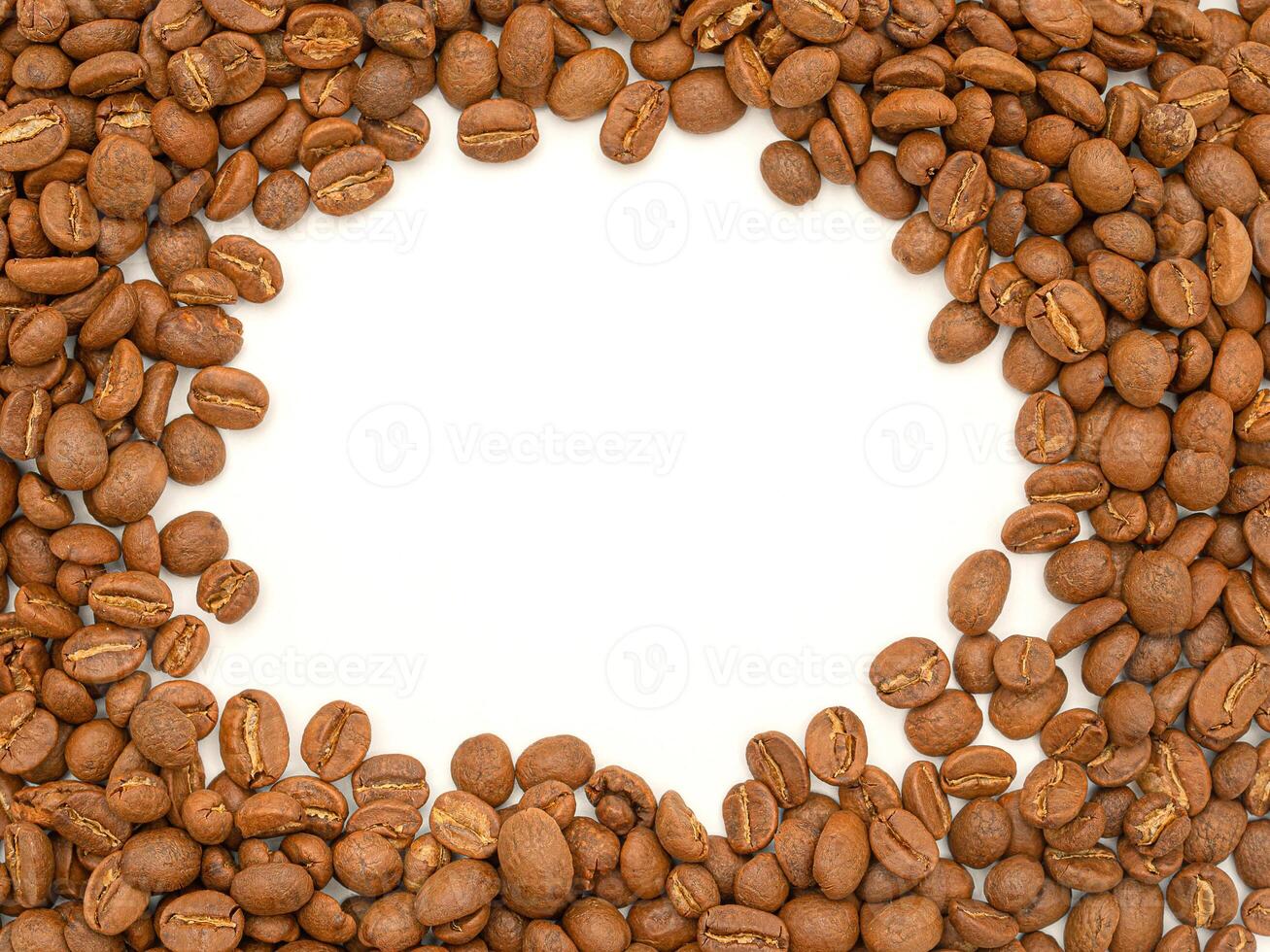 Top view of fresh aromatic roasted coffee beans background with copy space for text photo