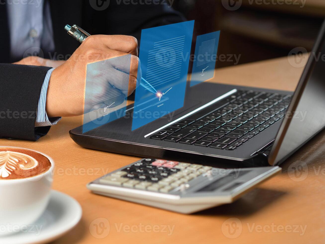 Electronic signature and paperless office concept. A businessman uses a pen to sign documents on a virtual screen photo