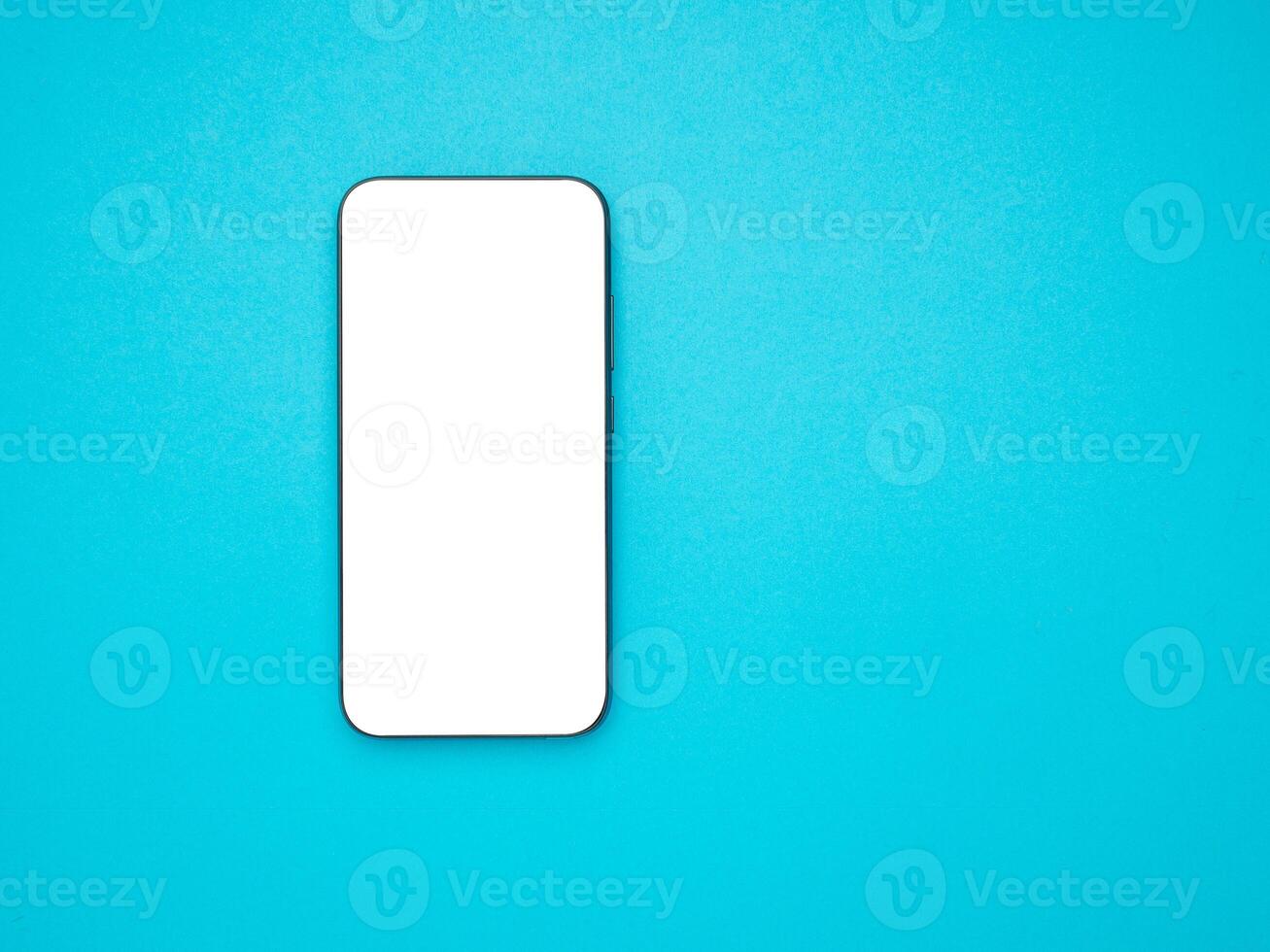 Top view mockup smartphone with a blank white screen on a light blue background photo