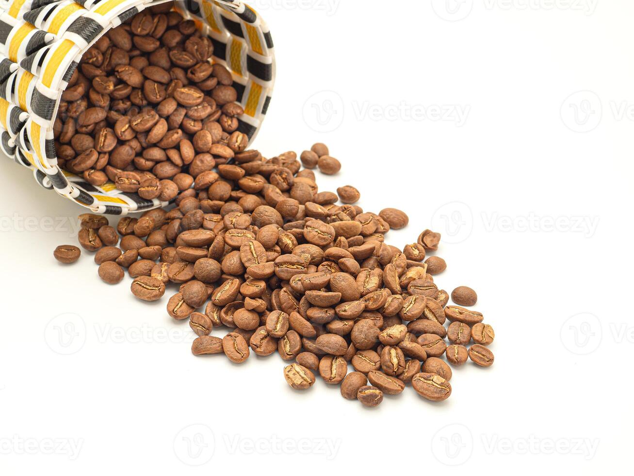 Coffee beans in a colorful basket on white background photo