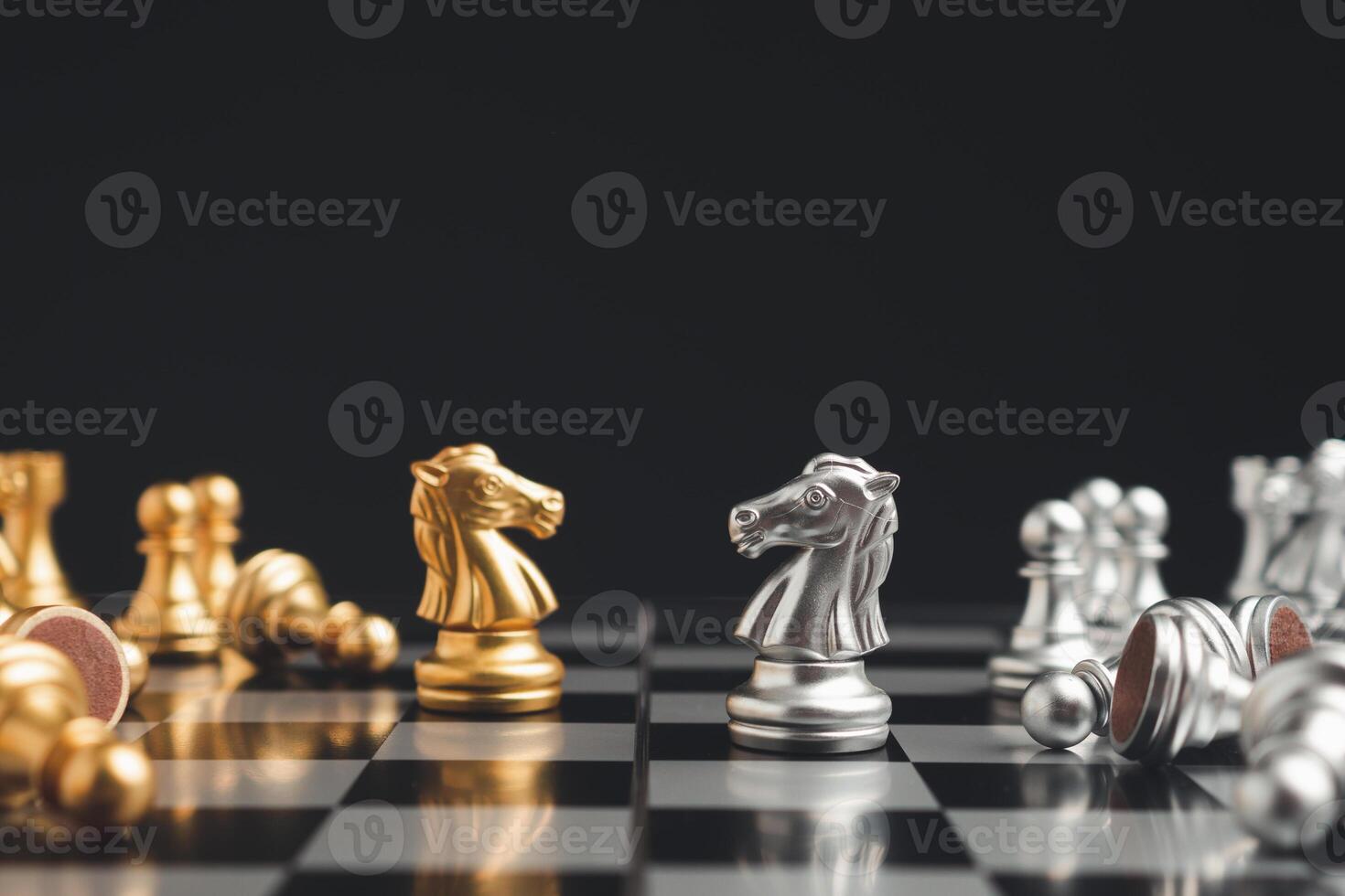 Chess game on a chessboard. The symbol of leadership, struggle, victory, strategy, and business concepts photo