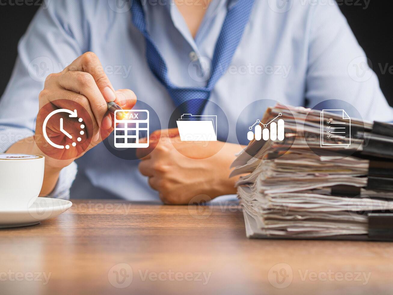Businessmanan using a tax form to complete an individual income tax payment form on a virtual screen photo