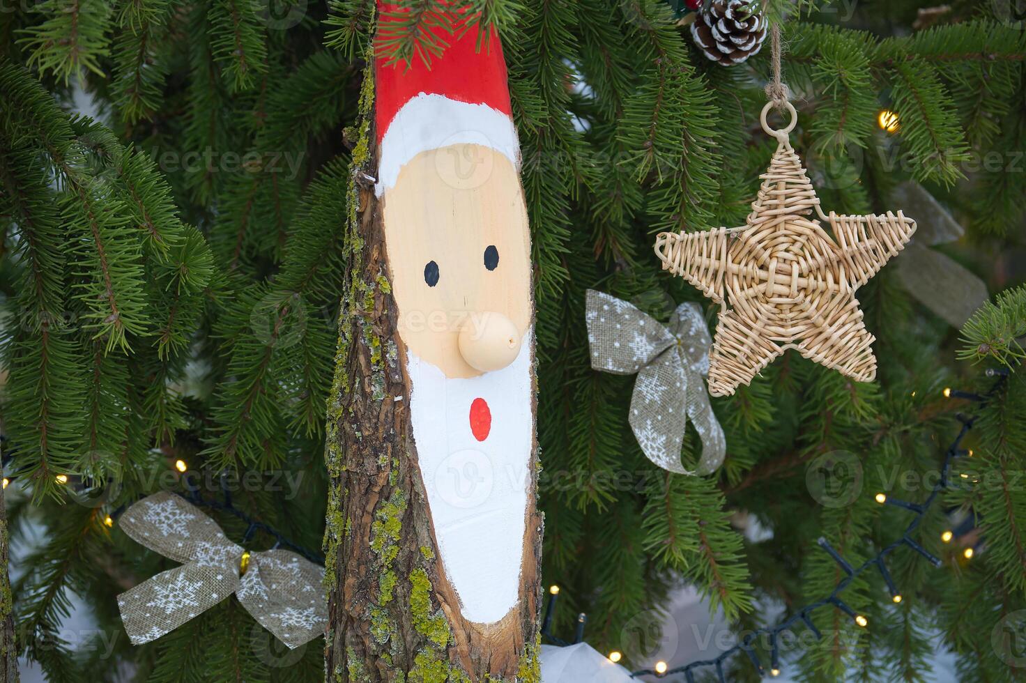 Close-Up of Rustic Christmas Decorations on Evergreen Tree photo
