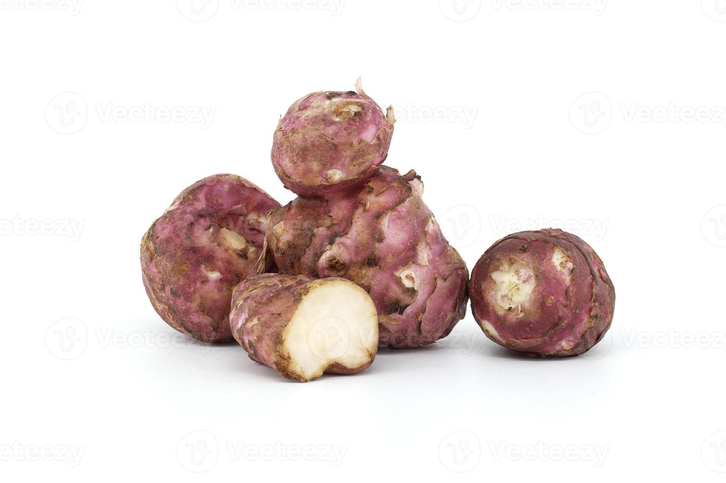 Raw Purple Jerusalem Artichokes on White Background photo