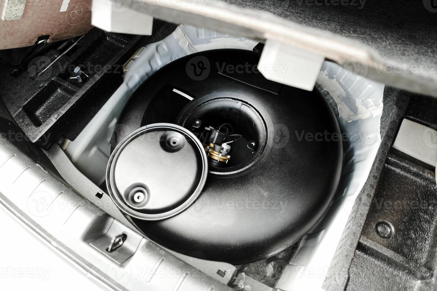 LPG or Propane gas container in vehicle trunk , Car alternative energy concept photo