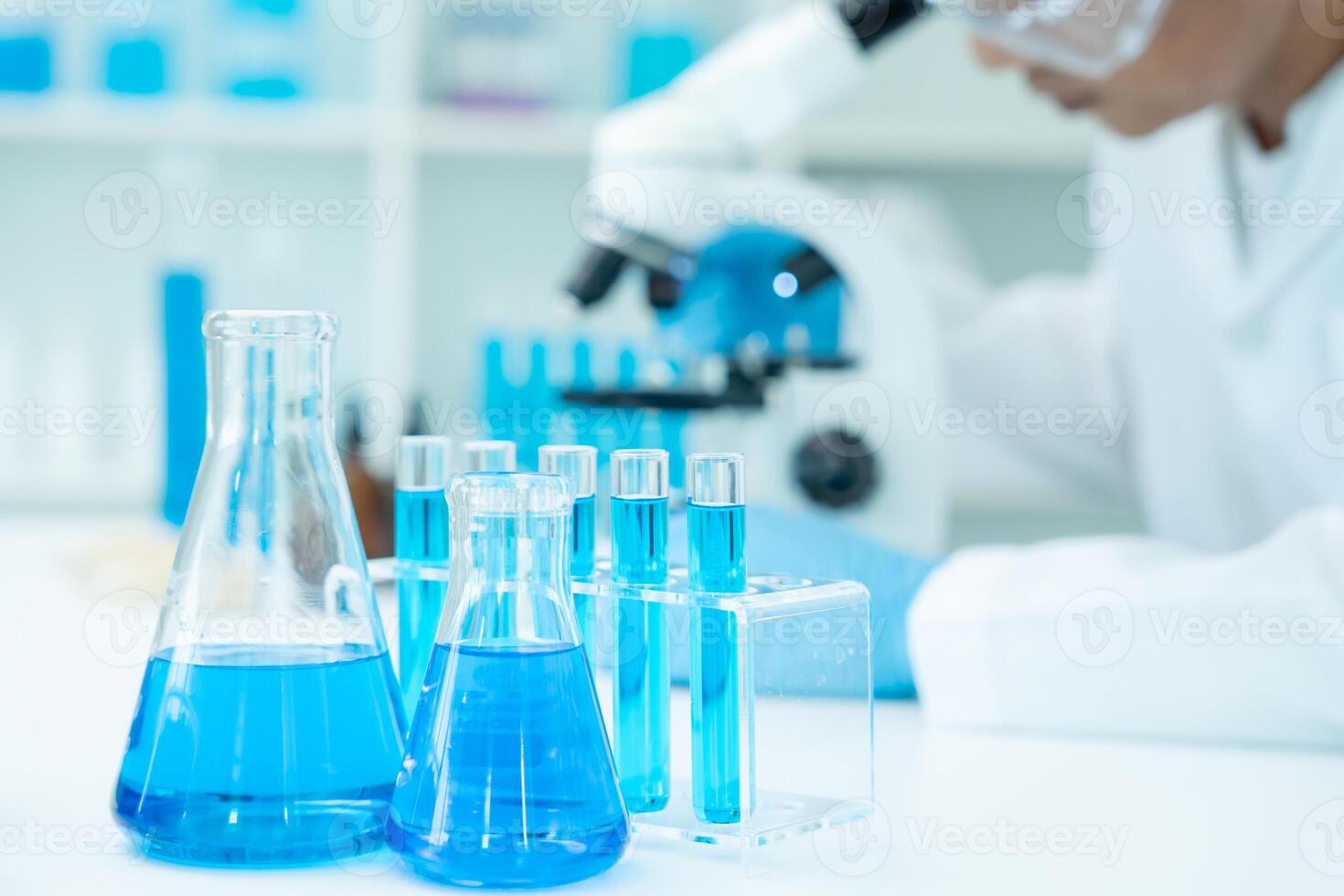 Scientist analyze biochemical samples in advanced scientific laboratory. Medical professional use microscope look microbiological developmental of viral. Biotechnology research in science lab. photo