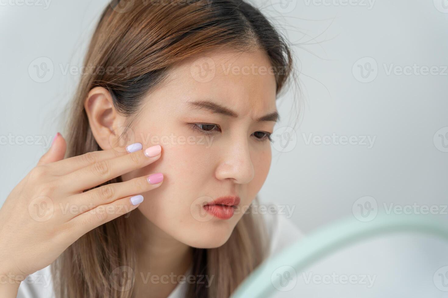 Woman worried about face Dermatology, large pores, uneven face, sensitive skin, red face from sunburn, acne, dry skin, large pores ,rash face, dull, freckles, wrinkle, skin problem, beauty photo