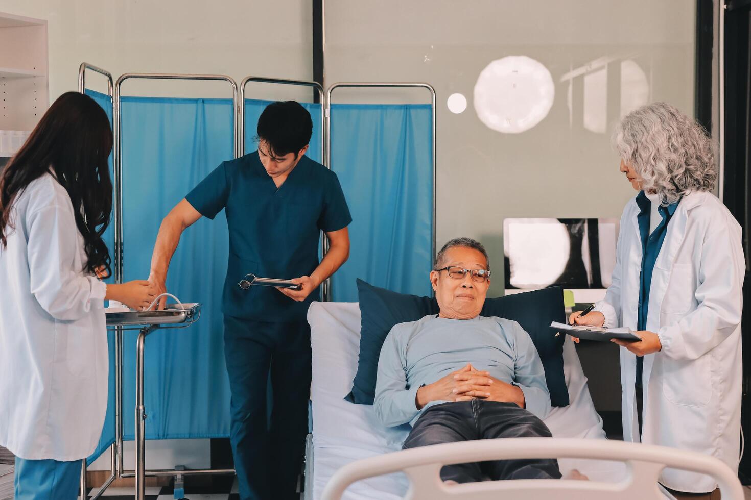 A team of doctors and nurses are working to treat a female patient in the patient's room. photo