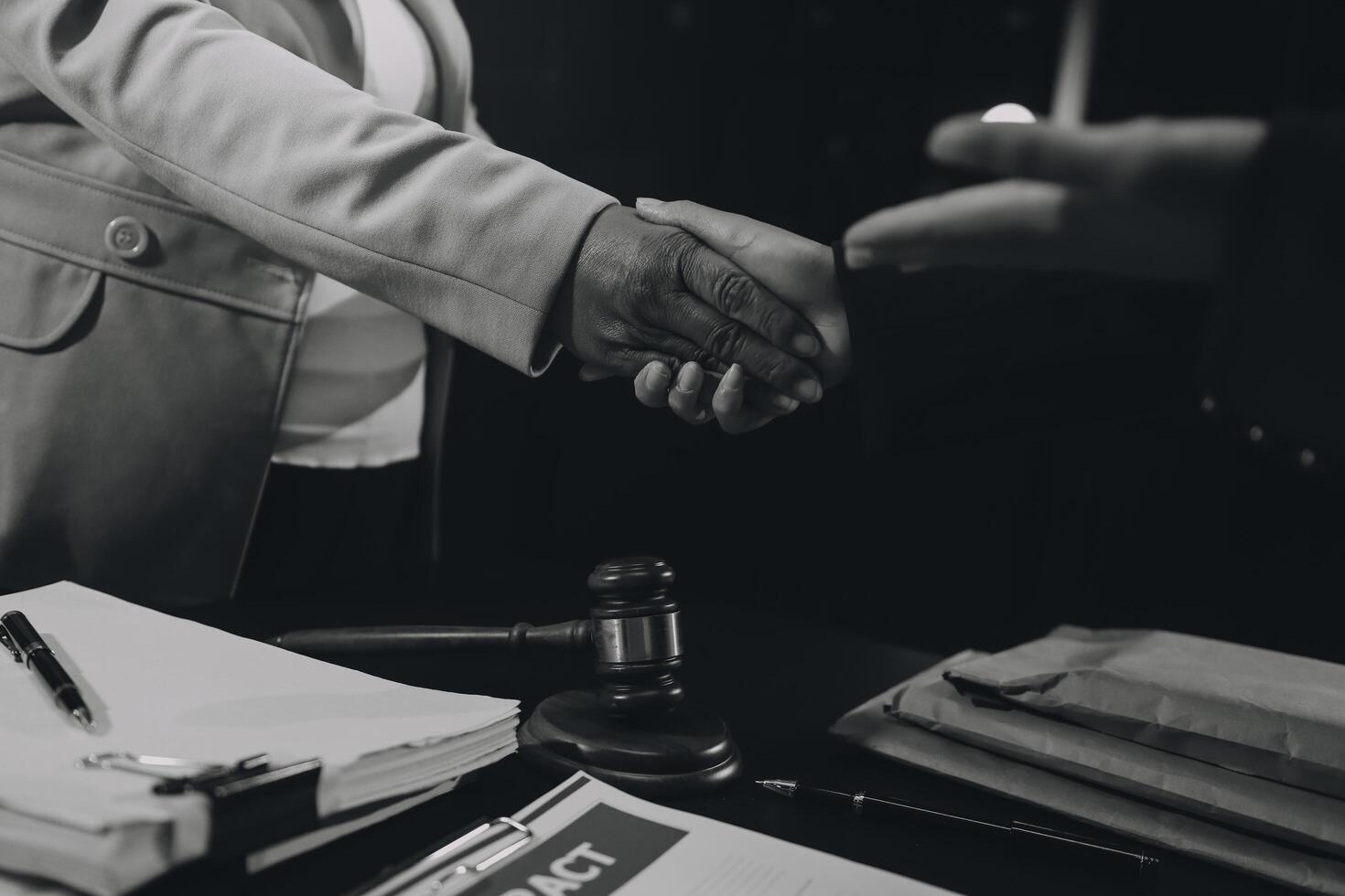 Judge gavel with Justice lawyers having team meeting at law firm background. Concepts of Law and Legal services. photo