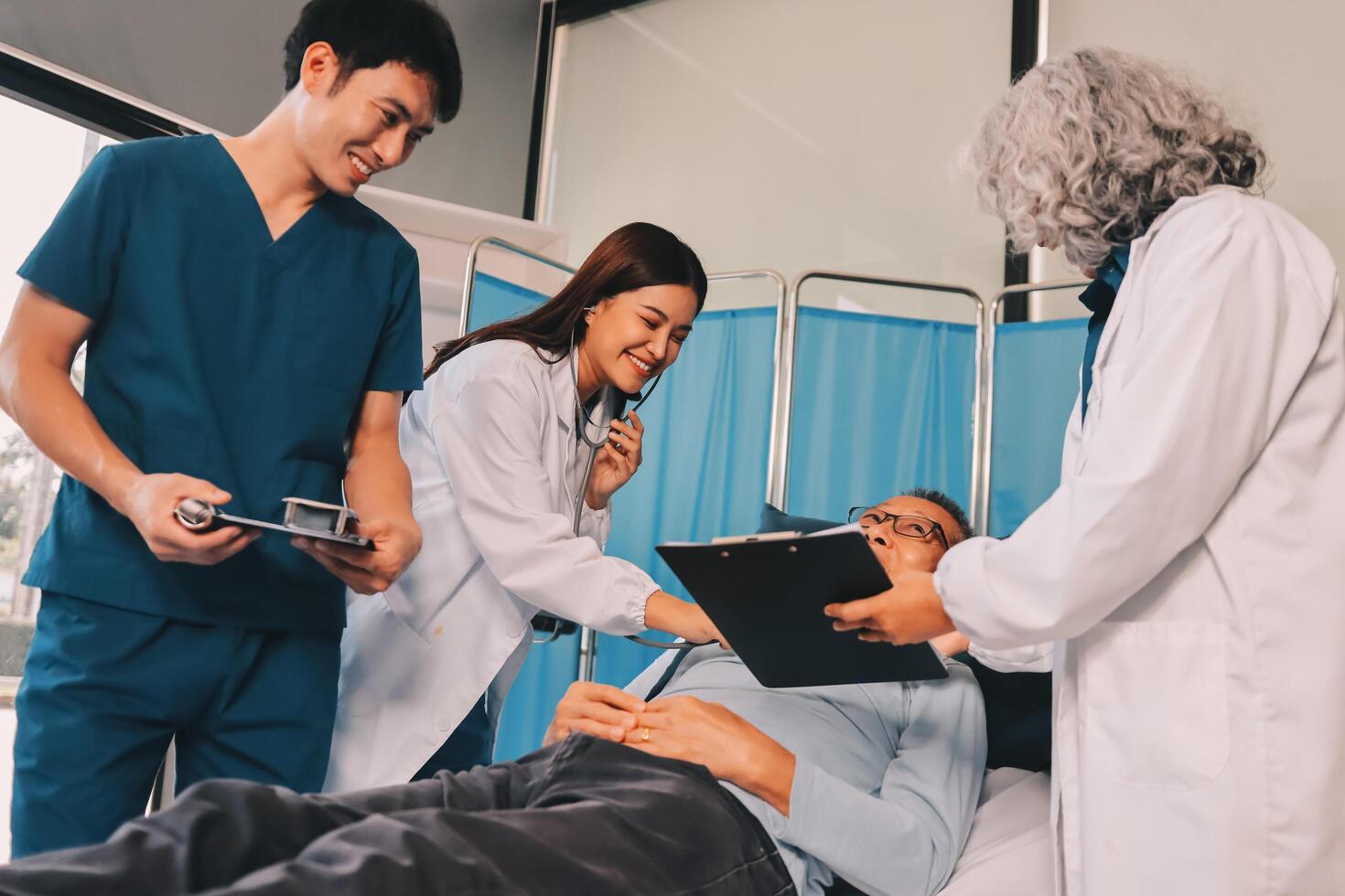 A team of doctors and nurses are working to treat a female patient in the patient's room. photo