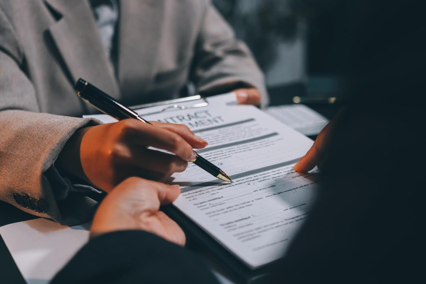 Close up Business people or Real Estate agent explain signing agreement for sale house to client. Property, Insurance, Broker concept. photo