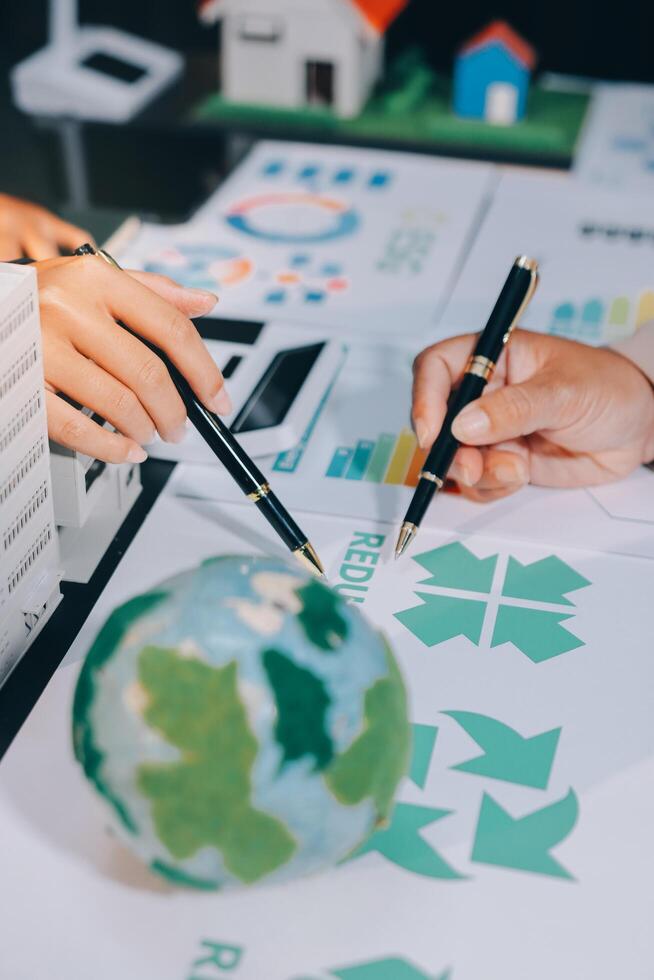 Carbon offset price report CO2 emission. Future growth Net zero waste in ESG ethical SME office protect climate change global warming social issues project. Group of asia people Eco friendly SDGs plan photo