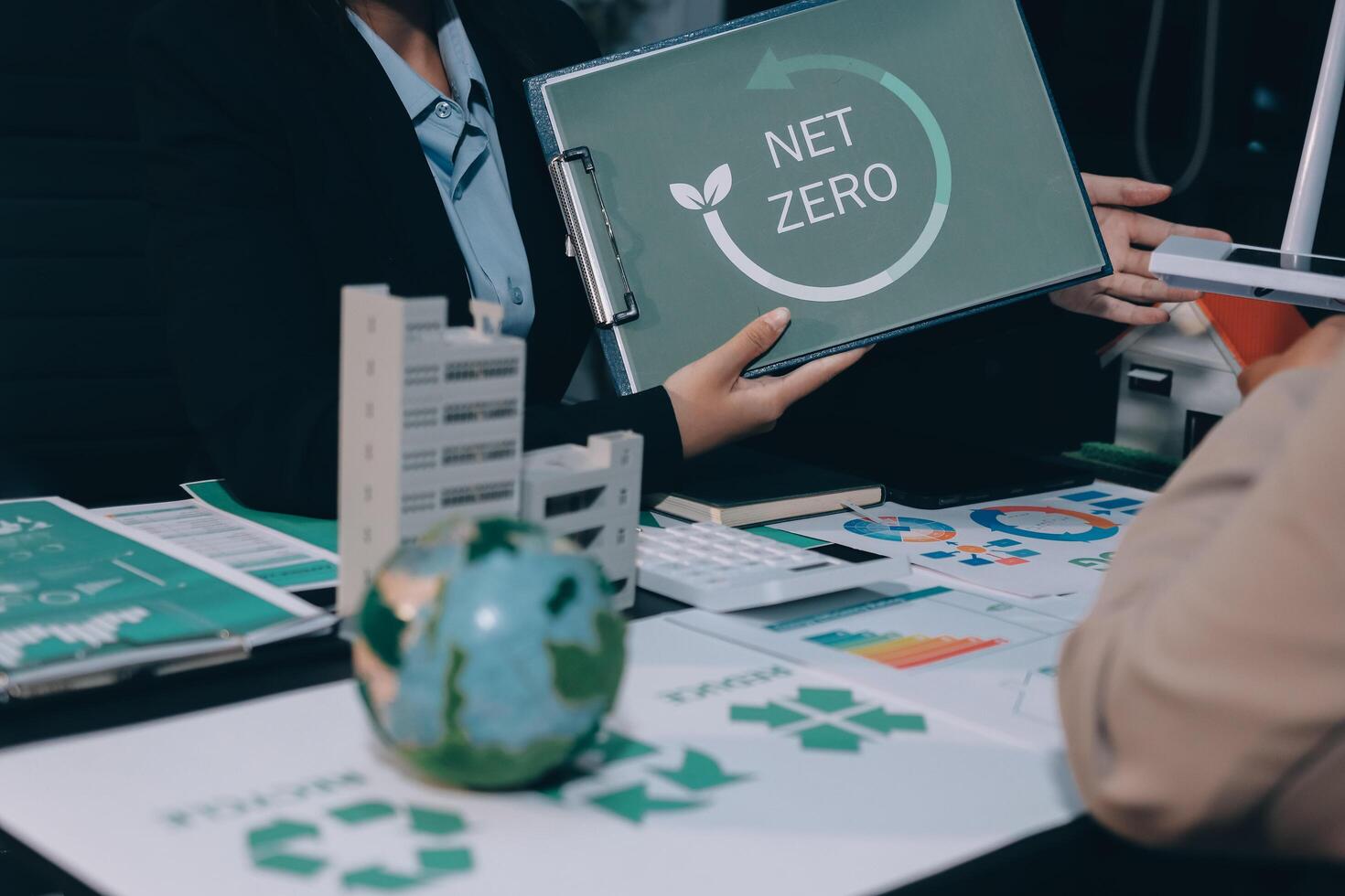 Carbon offset price report CO2 emission. Future growth Net zero waste in ESG ethical SME office protect climate change global warming social issues project. Group of asia people Eco friendly SDGs plan photo