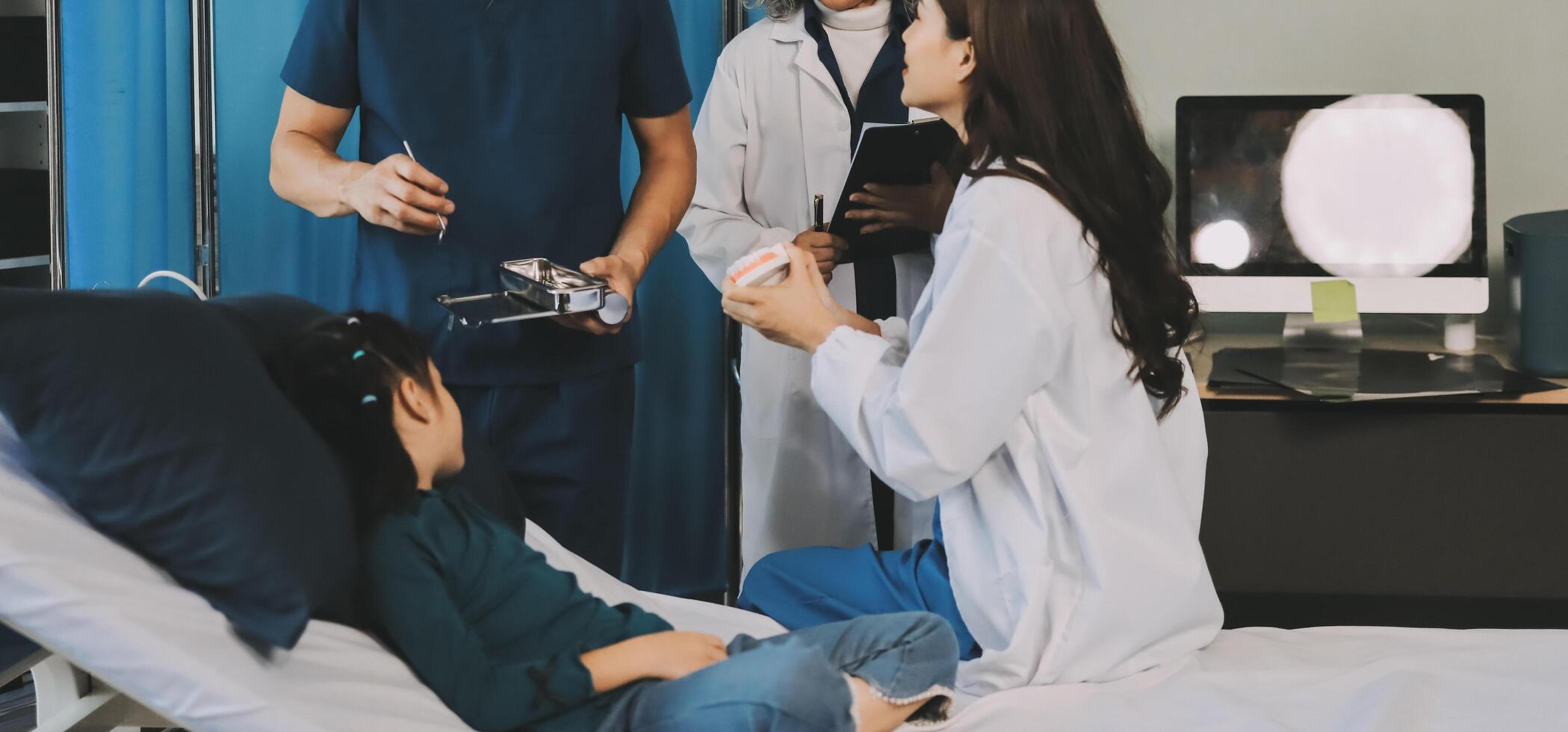 A team of doctors and nurses are working to treat a female patient in the patient's room. photo