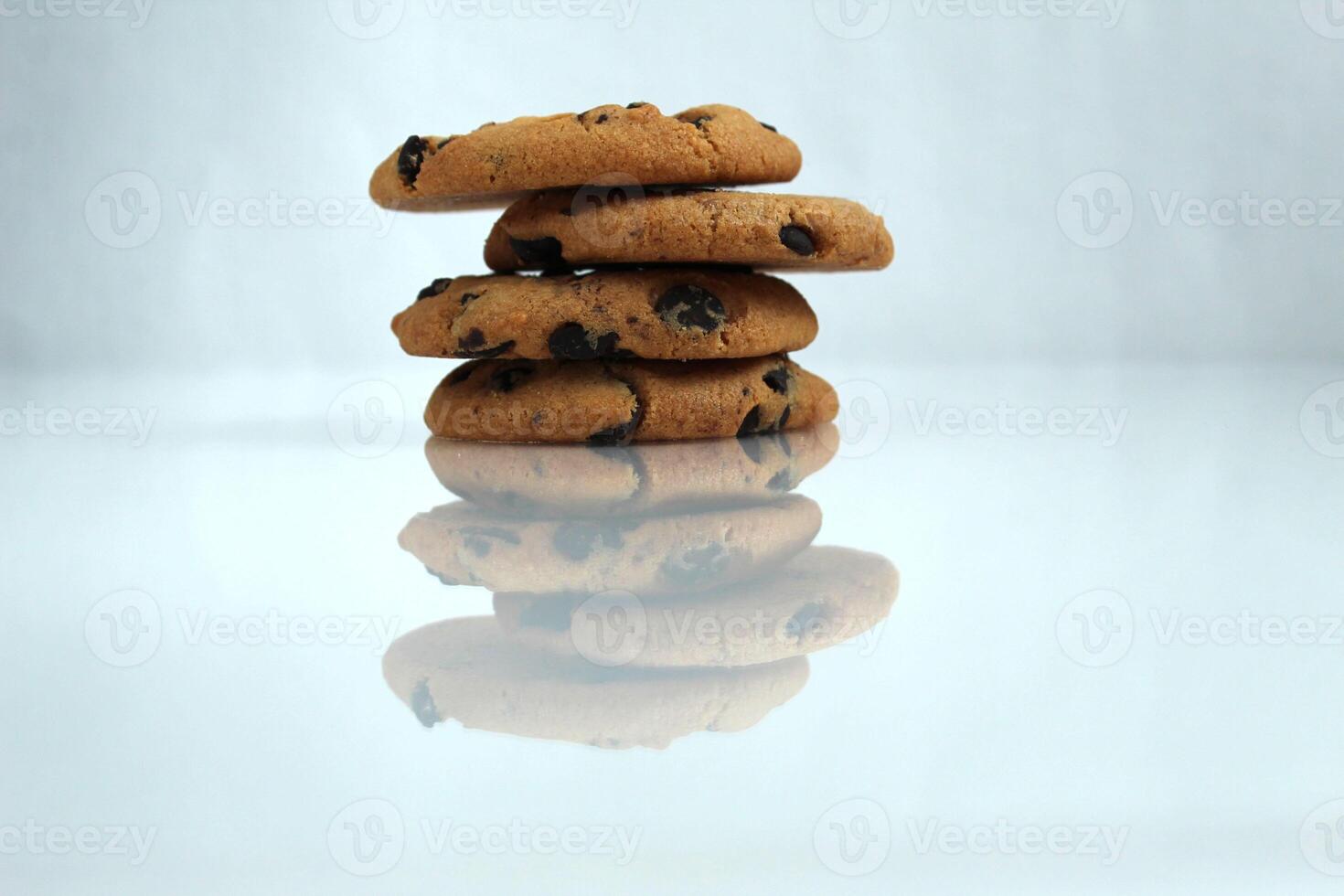 Chocolate chip cookies with chocolate chips on a white light background with space for copyspace text photo