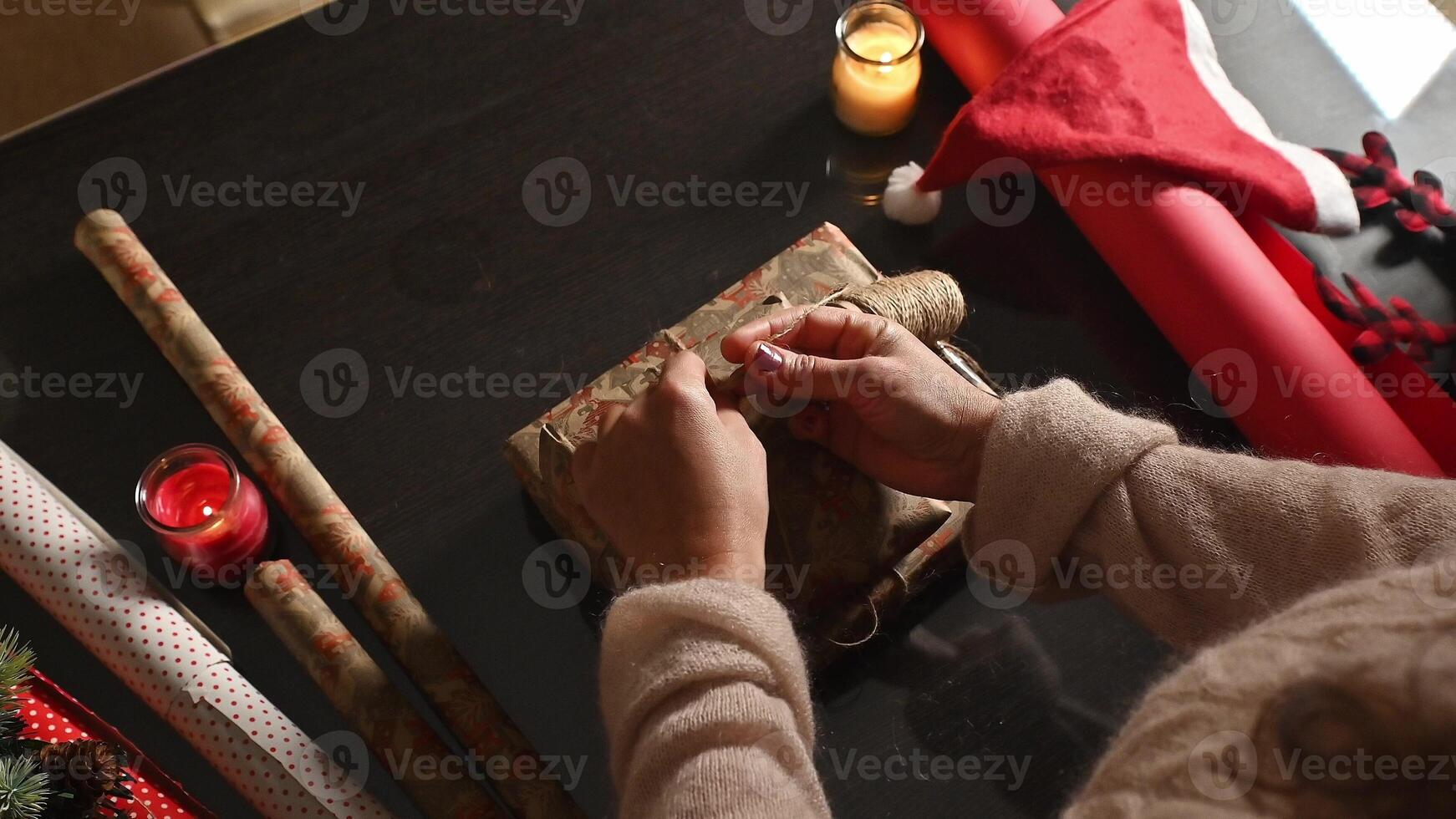 Wrapping gift on festive table photo