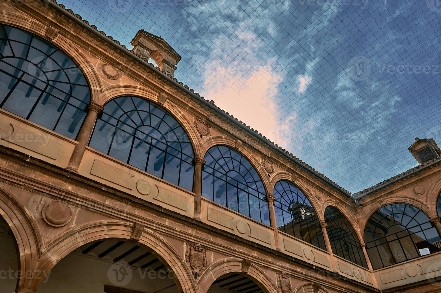 Elegant arched architecture under a bright blue sky photo