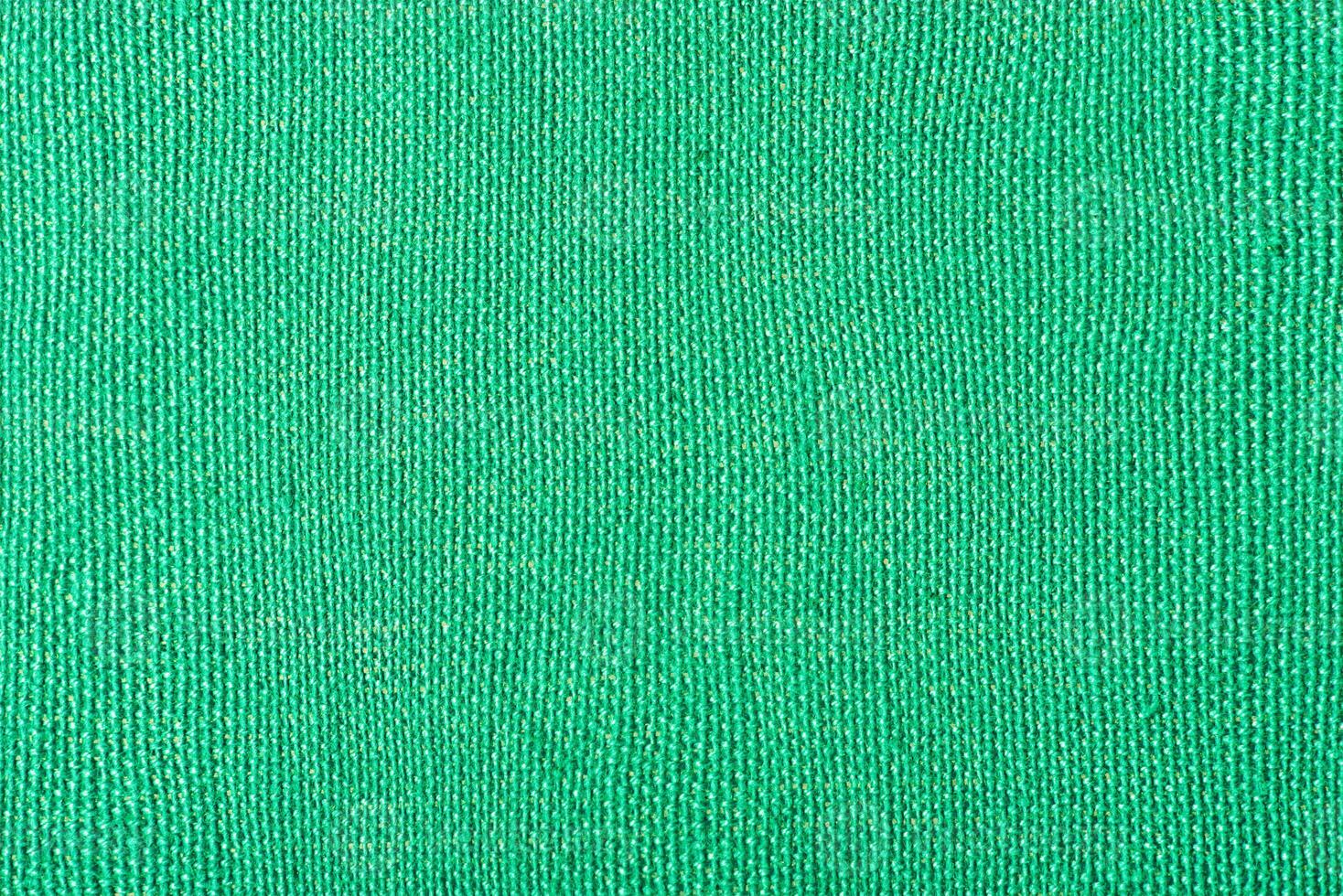 Green fabric background macro photo horizontal frame.