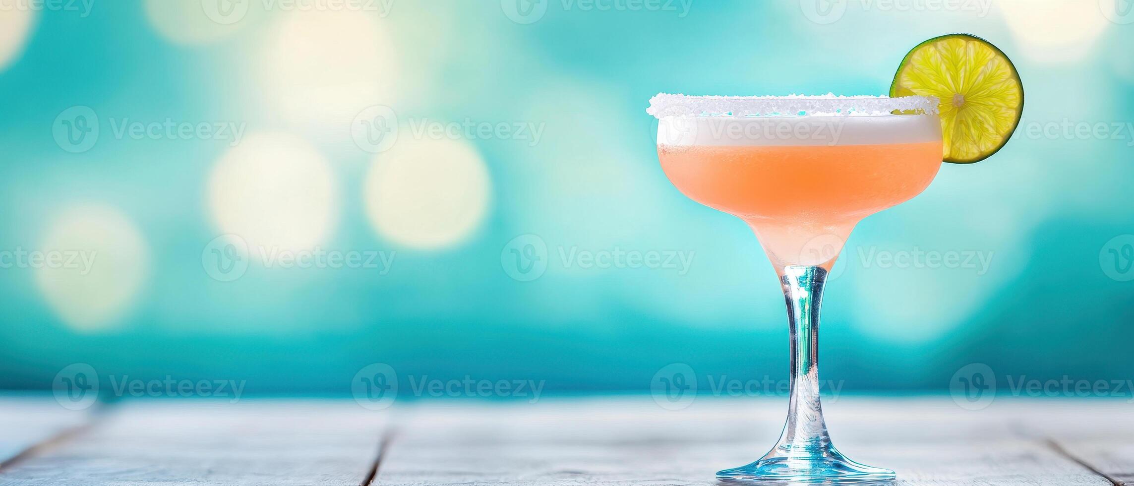 refreshing frozen margarita with salted rim and lime garnish, perfect for summer enjoyment. vibrant colors and bokeh background enhance its appeal photo