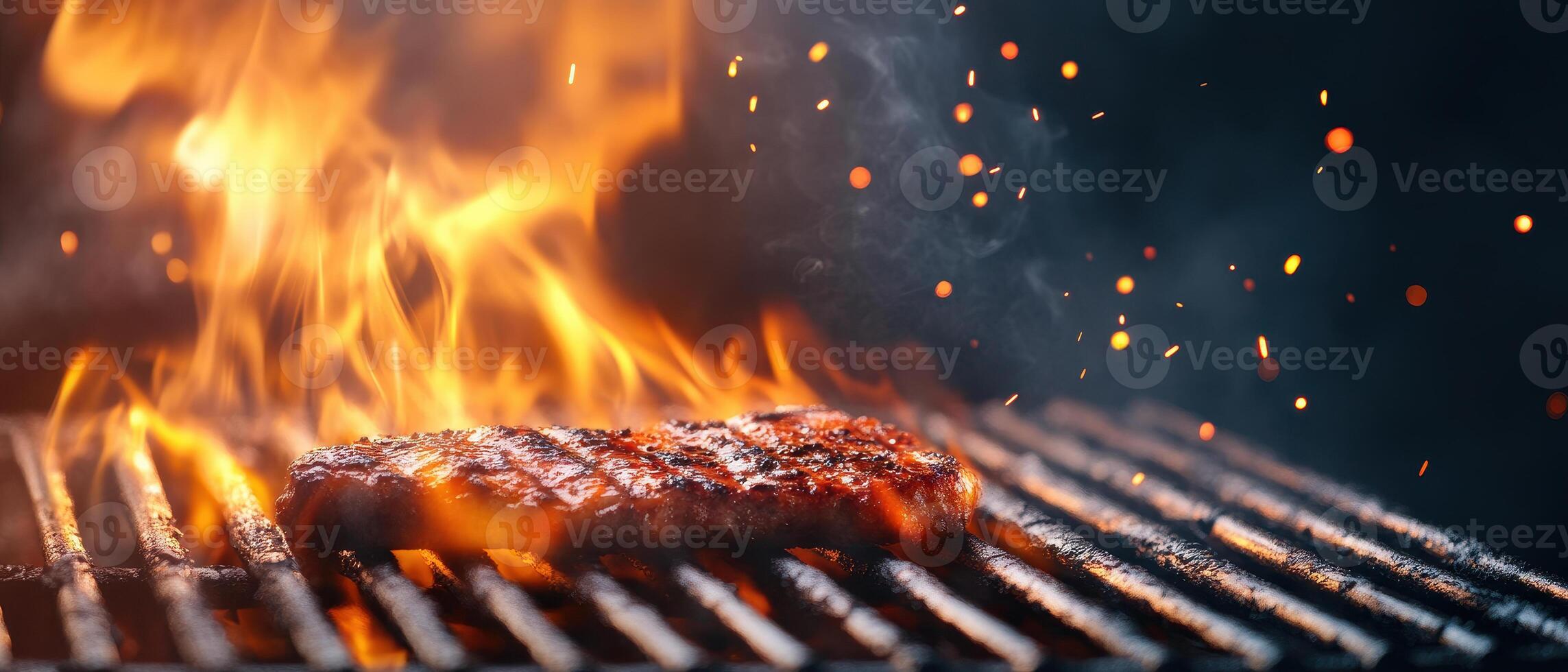 Grilled steak sizzling on barbecue with flames and sparks, creating vibrant and appetizing scene. Perfect for food lovers and barbecue enthusiasts photo
