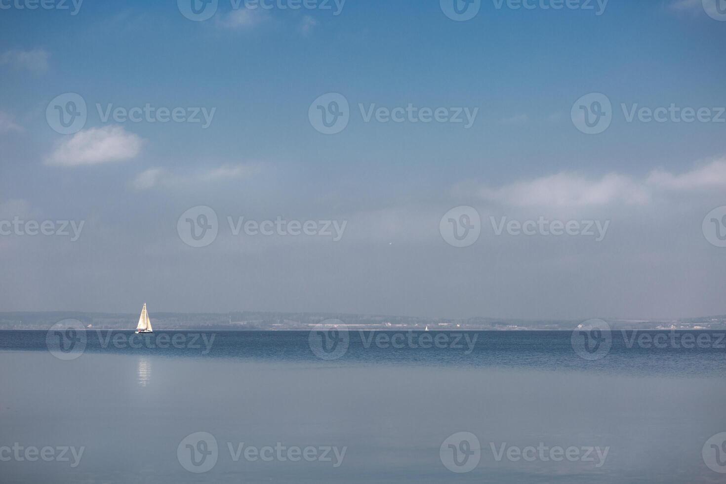 lonely sailboat at sea photo