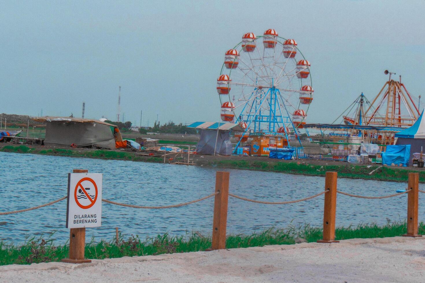 A fence with a sign photo