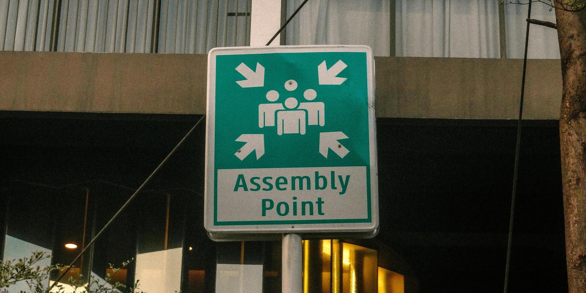 A sign that says assembly point photo