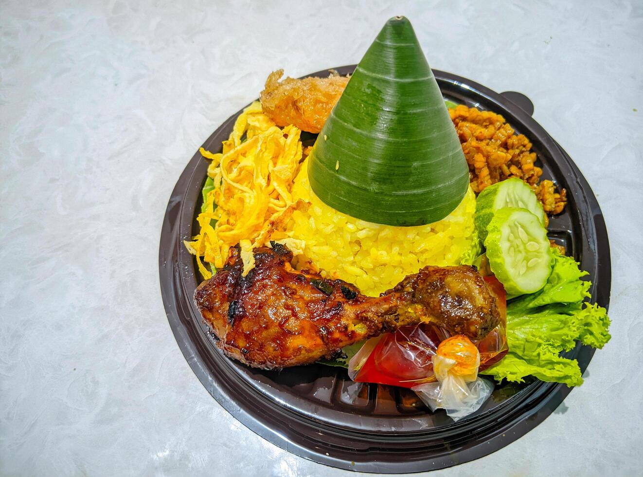 A plate with food on it and a green hat photo