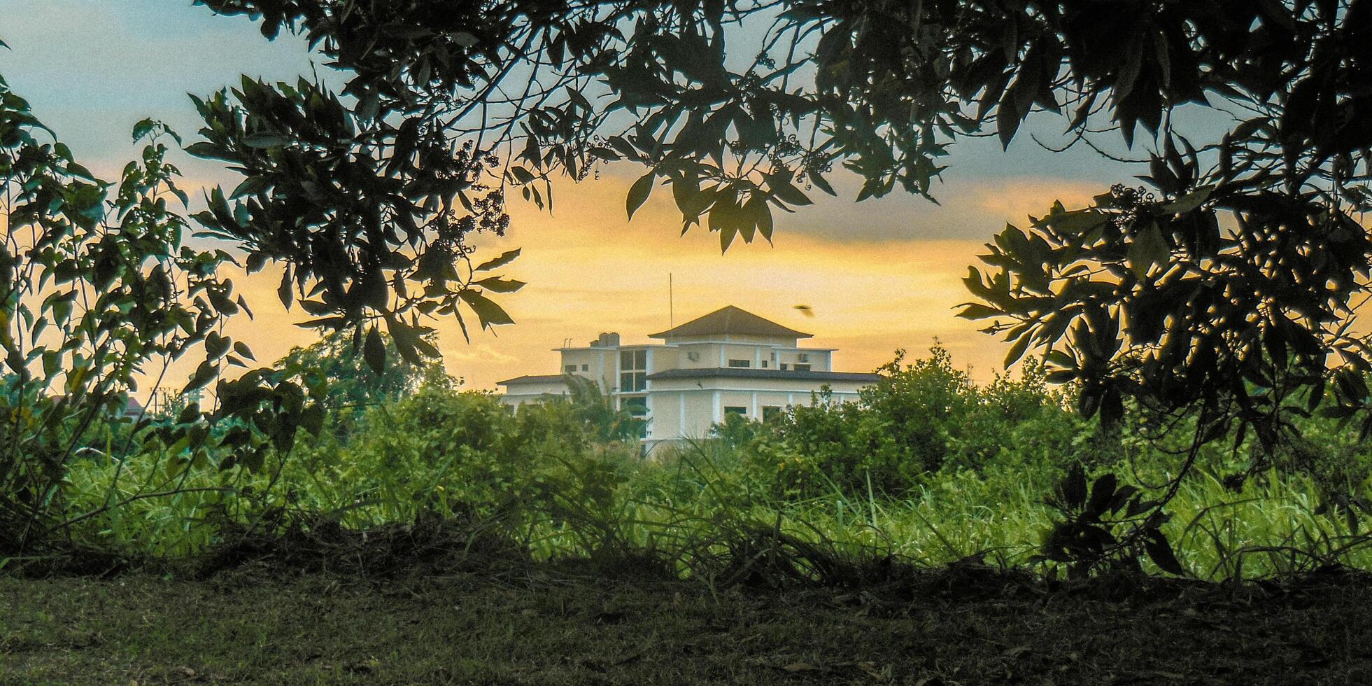 A large building with a clock tower in the background photo