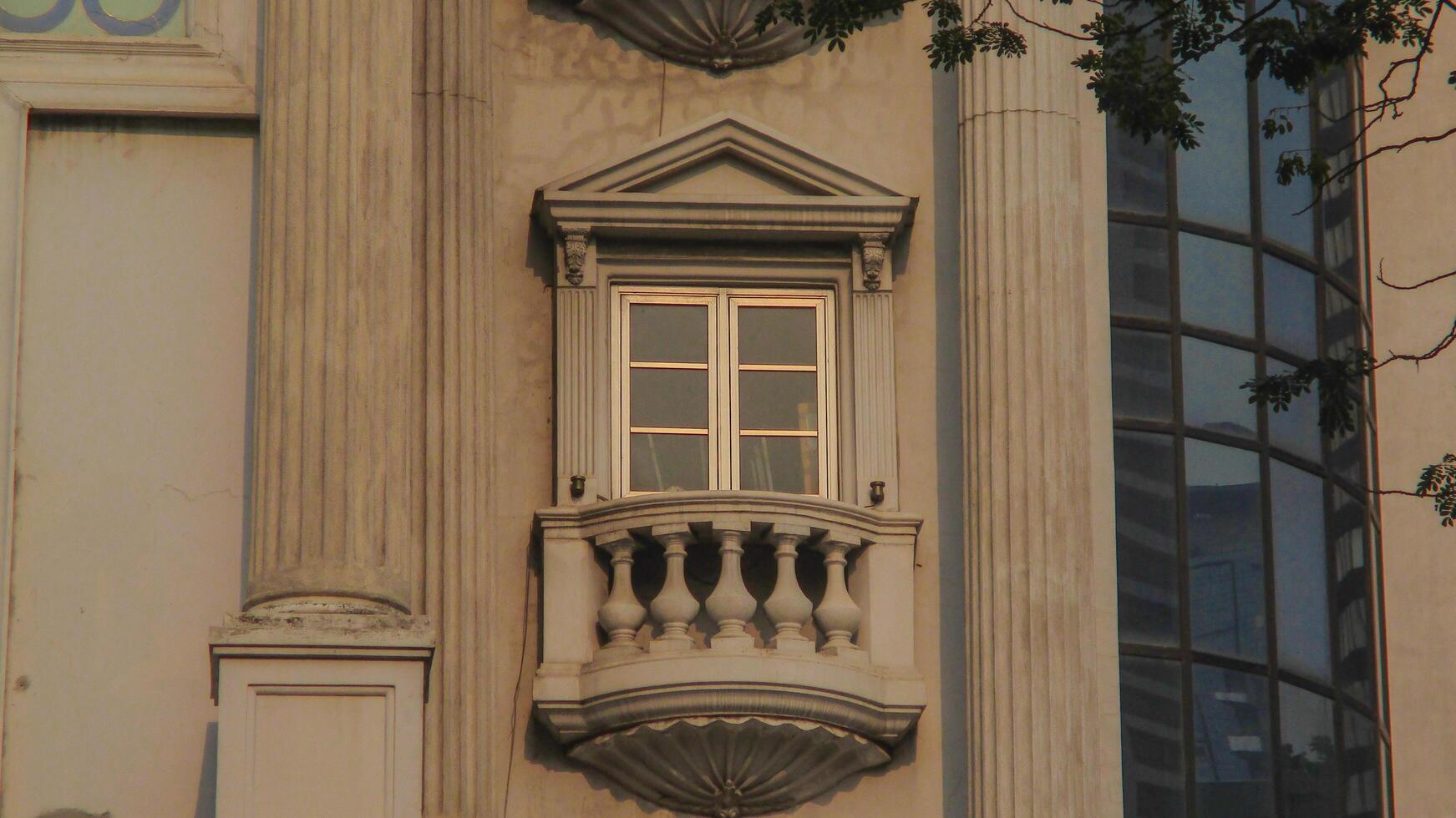 A clock on a building with a window photo