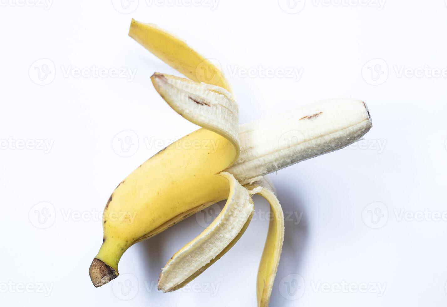 Peeled banana isolated on white background photo